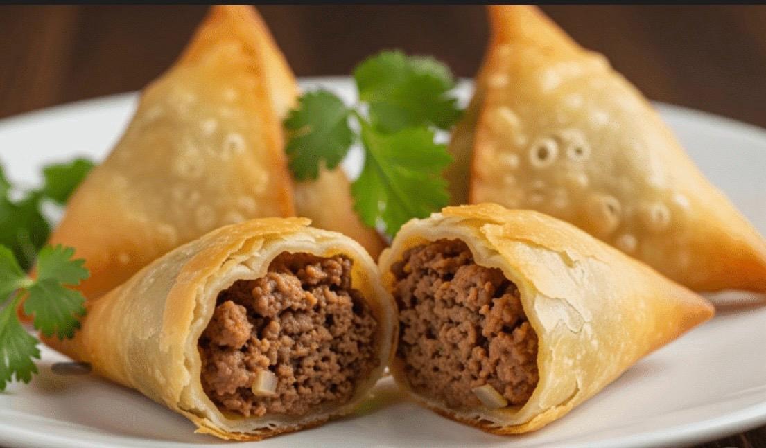 Beef Samosa (2 PCS) at Manvirros Indian Grill - Crispy golden pastries filled with spiced beef and vegetables