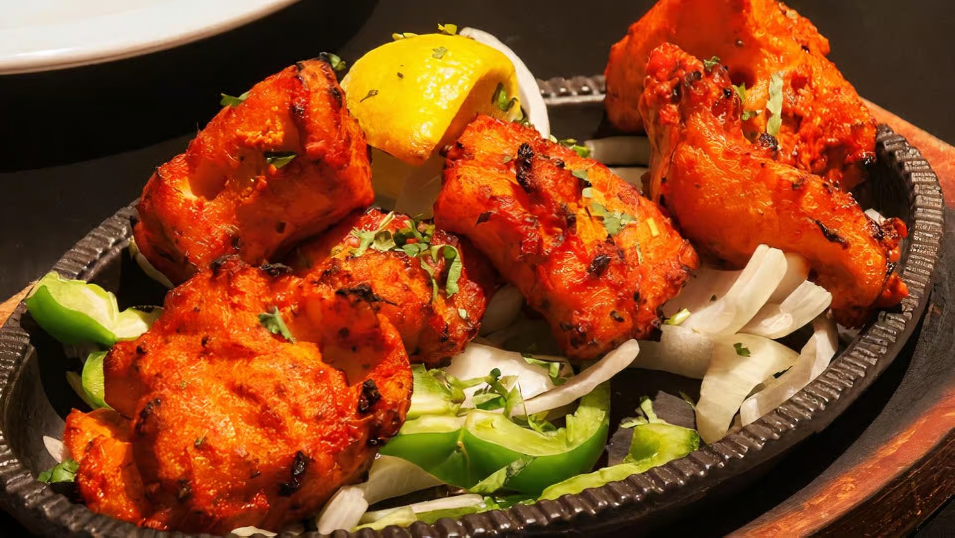 Tandoori Fish at Manvirros Indian Grill - Fresh fish fillets marinated in tandoori spices and grilled